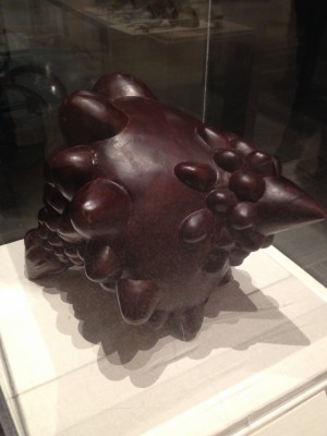 This piece was modeled in Rhino, it was then sent to China and  carved via a traditional process. If you look closely, you can see tool marks.